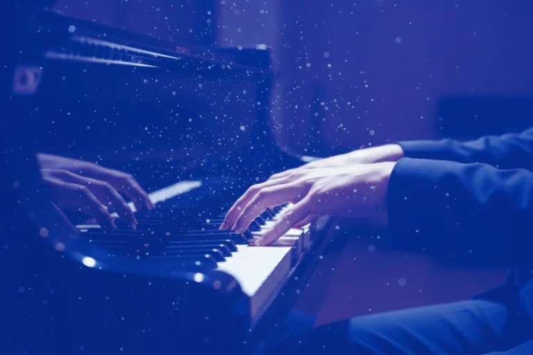Composer playing piano while creating a custom Brand Sound Signature for a sonic branding project